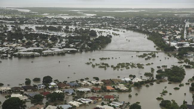 The flooded suburb of Annandale is seen from above in Townsville, Monday, February 4, 2019. Hundreds of people still waiting for help and evacuation centres are filling up fast, with unprecedented water releases from the city's swollen dam having sent torrents of water down the Ross River and into the city, swamping roads, yards and homes. (AAP Image/Andrew Rankin) NO ARCHIVING