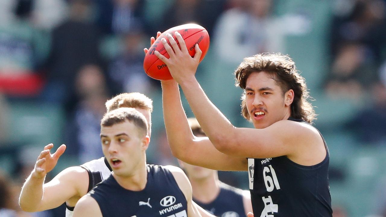 Tyreece Leiu takes a strong mark. Picture: Dylan Burns/AFL Photos via Getty Images