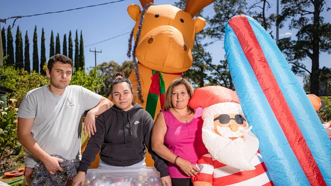 Chandlar Sutterby, Edna Mahina and Tanya Sutterby will again stage a massive lights display at their home on The Boulevard in Ivanhoe, despite Banyule Council not wanting to promote the event. File Picture: Jason Edwards