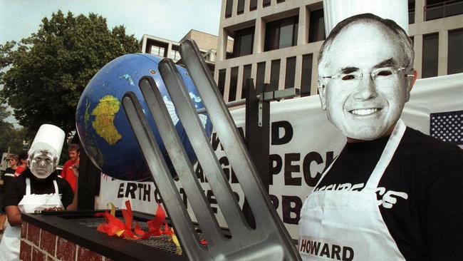 Greenpeace activists perform street theatre in 2002 to protest against the decision of Prime Minister Howard to reject the Kyoto Protocol. Picture: File