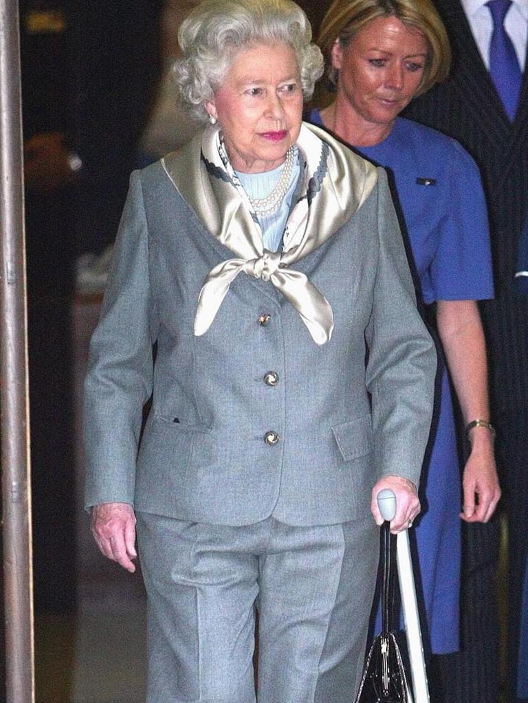 The Queen using her walking stick after undergoing minor surgery for damaged cartilage on her right knee Monday. Picture: AP/Dave Caulkin.