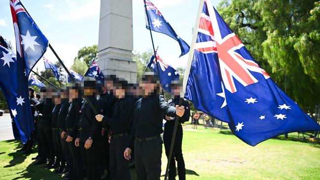 ADELAIDE, AUSTRALIA - JANUARY 26: Members of the National Socialist Network (NSN) during a counter protest on North Terrace and East Terrace on January 26, 2025 in Adelaide, Australia. Australia Day, formerly known as Foundation Day, is the official national day of Australia and is celebrated annually on January 26 to commemorate the arrival of the First Fleet to Sydney in 1788. Many indigenous Australians refer to the day as 'Invasion Day' and there is a small but growing movement to change the date amid broader debate on the day's significance. (Photo by Tracey Nearmy/Getty Images)