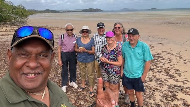 Pajinka traditional owner and tour guide attached to the Cape York Peninsula Lodge Michael Solomon with guests at the Tip. Picture: Supplied