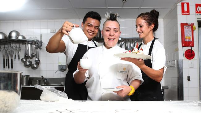 L-R Giles Gabutina, Anna Polyviou and Rhiann Mead got busy in the kitchen of the Shangri-La Hotel for DoSomething Day last year.