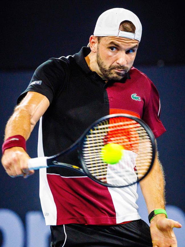 Grigor Dimitrov of Bulgaria hits a return during his victory over Jordan Thompson. Picture: Patrick Hamilton/AFP