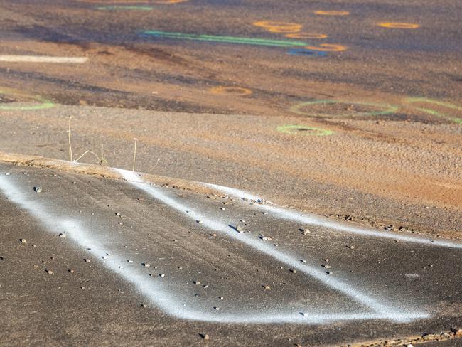 Forensic paint markings map out the scene on the Stuart Hwy. Picture: Floss Adams.