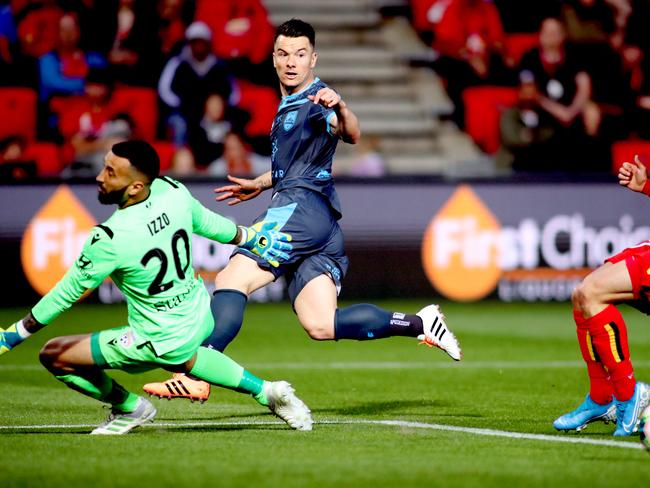 Alexander Baumjohann of Sydney FC splits the defence for a goal by Adam Le Fondre of Sydney FC during the Round 1 A-League match between Adelaide United and Sydney FC at Coopers Stadium in Adelaide, Friday, October 11, 2019. (AAP Image/Kelly Barnes) NO ARCHIVING, EDITORIAL USE ONLY