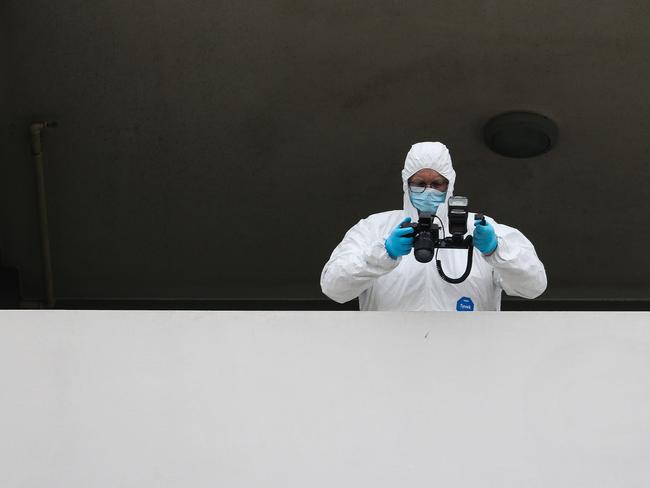 Forensic officers at the apartment on Thursday morning. Picture: Gaye Gerard