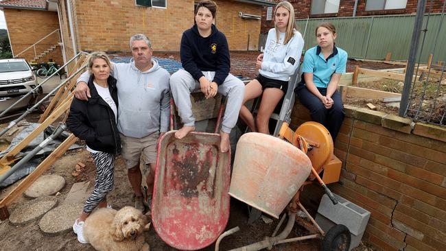 Tradie Clinton Hood runs CJ Construction in the Sutherland Shire and says the construction shutdown has put pressure on employers and employees. Pictured with wife Kristie and kids Connor, Kayla, Claudia and dog Chico. Picture: Toby Zerna