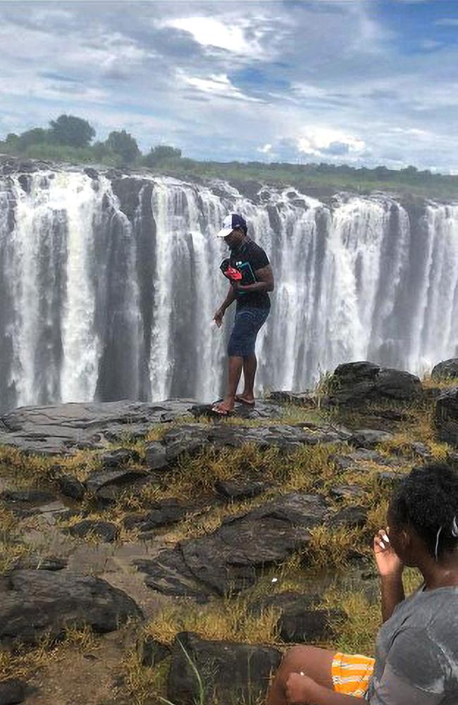 Zimbabwe. Victoria Falls. Steam train. Man looking out of window