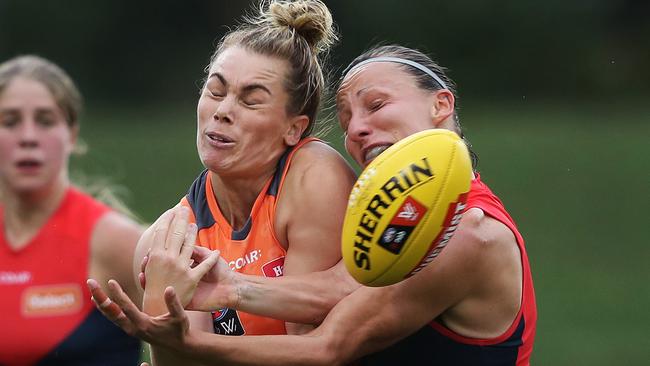 GWS and Melbourne fought out a very physical encounter in tough conditions. Picture: Phil Hillyard