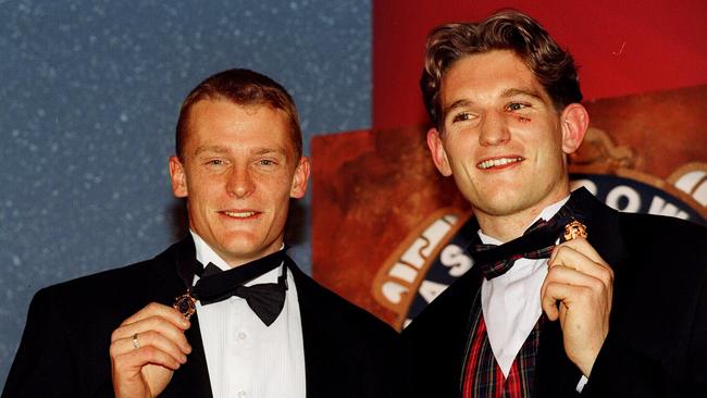 Michael Voss and James Hird after tying the 1996 Brownlow Medal. Picture: Andrew Tauber