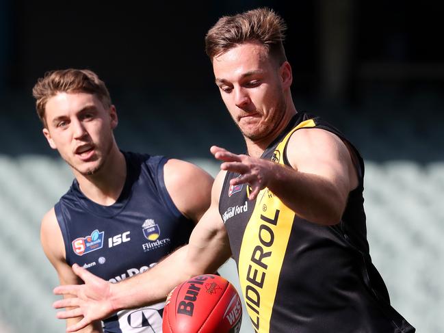 SANFL - Sunday, 5th July 2020 - Glenelg v South Adelaide at the Adelaide Oval. Tigers Cory Gregson gets his kick away from South Adelaide Thomas Highmore Picture: Sarah Reed