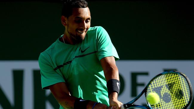 INDIAN WELLS, CA - MARCH 15: Nick Kyrgios of Australia returns a shot to Novak Djokovic of Serbia during the BNP Paribas Open at the Indian Wells Tennis Garden on March 15, 2017 in Indian Wells, California. Matthew Stockman/Getty Images/AFP == FOR NEWSPAPERS, INTERNET, TELCOS &amp; TELEVISION USE ONLY ==