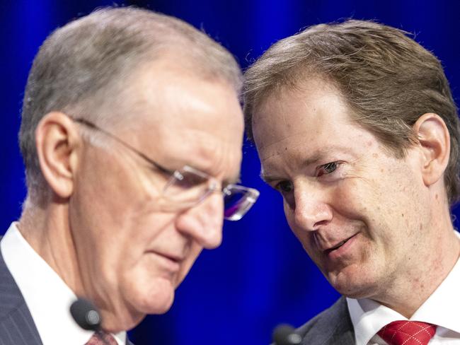 Interim executive chairman Mike Wilkins (left) and acting Group General Counsel David Cullen speak during the financial services group AMP Annual General Meeting (AGM) in the Savoy Ballroom at the Grand Hyatt, Melbourne, Thursday, May 10, 2018. AMP has apologised to shareholders for its extensive misconduct revealed at the banking royal commission. Speaking at AMP's annual general meeting in Melbourne, interim executive chairman Mike Wilkins vowed the company would win back the trust of its shareholders and the public. (AAP Image/Daniel Pockett) NO ARCHIVING