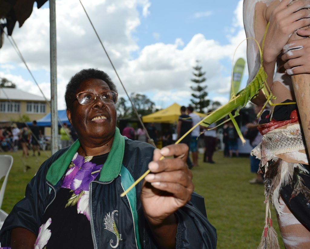 Aunty Patricia from the Saima Co-op making a grasshopper from a palm leaf at the Cultural Festival held at the Heritage Village on Sunday. Photo: Chris Ison / The Morning Bulletin. Picture: Chris Ison