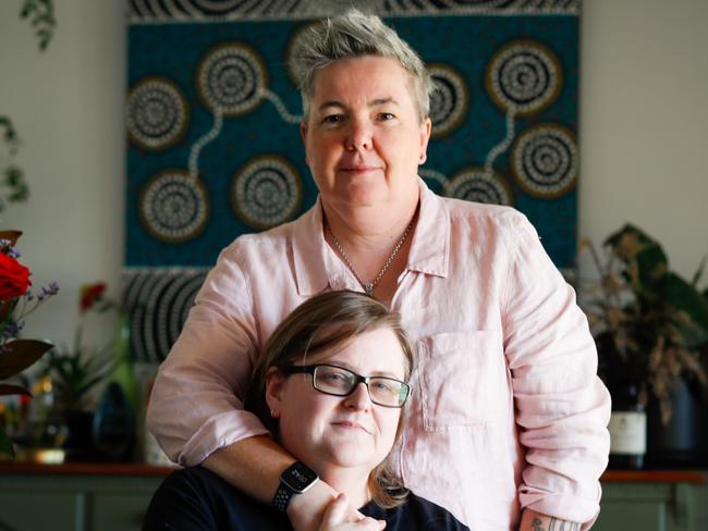 Megan and Julie (glasses) Etheridge left their husbands and found each other while working for rival car rental companies at Alice Springs Airport. The couple have moved back to Adelaide. Picture Matt Turner.