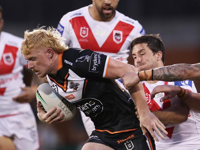 Zac Cini busts through the St George Illawarra Dragons defence during his NRL debut. Picture Matt King/Getty Images)