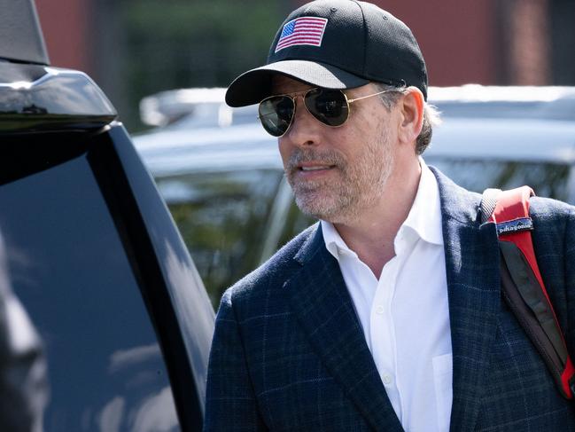 Hunter Biden walks to a waiting SUV after arriving with US President Joe Biden on Marine One at Fort McNair in Washington, DC, July 4, 2023, as they return to Washington after spending the weekend at Camp David, the presidential retreat in Maryland. (Photo by SAUL LOEB / AFP)