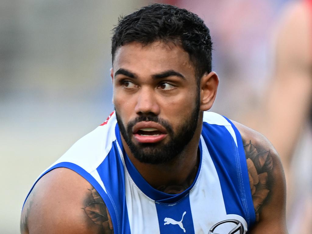 HOBART, AUSTRALIA – AUGUST 06: Tarryn Thomas of the Kangaroos runs the ball during the round 21 AFL match between North Melbourne Kangaroos and Melbourne Demons at Blundstone Arena, on August 06, 2023, in Hobart, Australia. (Photo by Steve Bell/Getty Images)