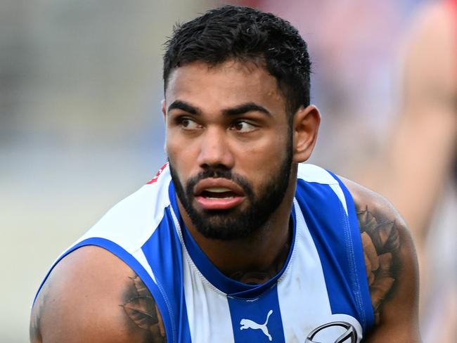 HOBART, AUSTRALIA – AUGUST 06: Tarryn Thomas of the Kangaroos runs the ball during the round 21 AFL match between North Melbourne Kangaroos and Melbourne Demons at Blundstone Arena, on August 06, 2023, in Hobart, Australia. (Photo by Steve Bell/Getty Images)