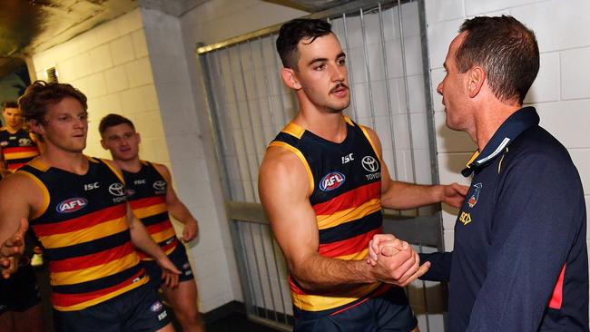 Adelaide Crows coach Don Pyke congratulates captain Taylor Walker.