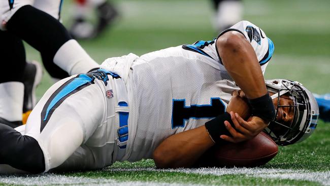 ATLANTA, GA - SEPTEMBER 16: Cam Newton #1 of the Carolina Panthers lays on the ground after a late hit by Damontae Kazee #27 of the Atlanta Falcons during the first half at Mercedes-Benz Stadium on September 16, 2018 in Atlanta, Georgia. Kevin C. Cox/Getty Images/AFP == FOR NEWSPAPERS, INTERNET, TELCOS &amp; TELEVISION USE ONLY ==