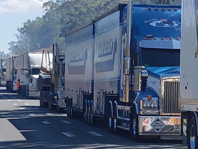 Trucks lined the Bruce Highway for more than 12 hours following a fiery two truck crash, 37km south of Miriam Vale on August 5. Picture: Rodney Stevens