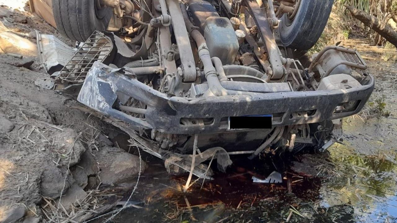 A worker had a lucky escape after its vehicle rolled over in a dam at a Bloomsbury property. Picture: RACQ CQ Rescue