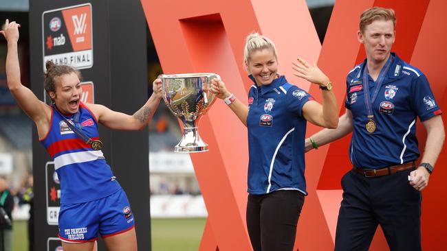 Ellie Blackburn, Katie Brennan and senior coach Paul Groves celebrate after winning the 2018 AFLW Grand Final between Western Bulldogs and Brisbane Lions at IKON Park. (Photo by Michael Willson/AFL Media/Getty Images)