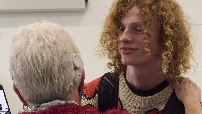 Kane Parker, 16, hugging his grandmother at Adelaide Airport, after Kane modelled for Prada in Milan, Thursday, June 27, 2024. Picture: Matt Loxton