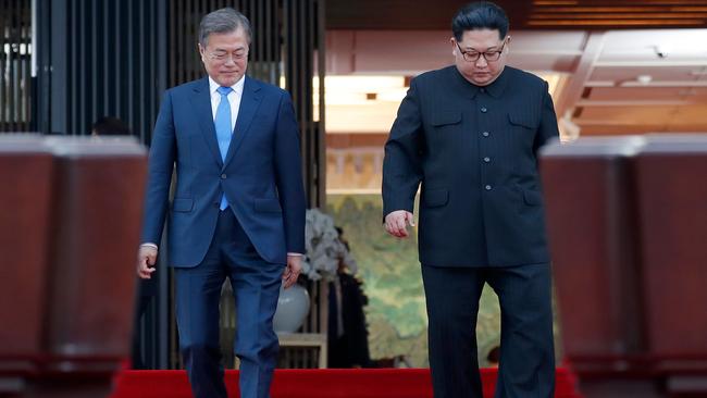 Kim Jong-un and Moon Jae-in walk to announce their joint statement. Picture: AFP