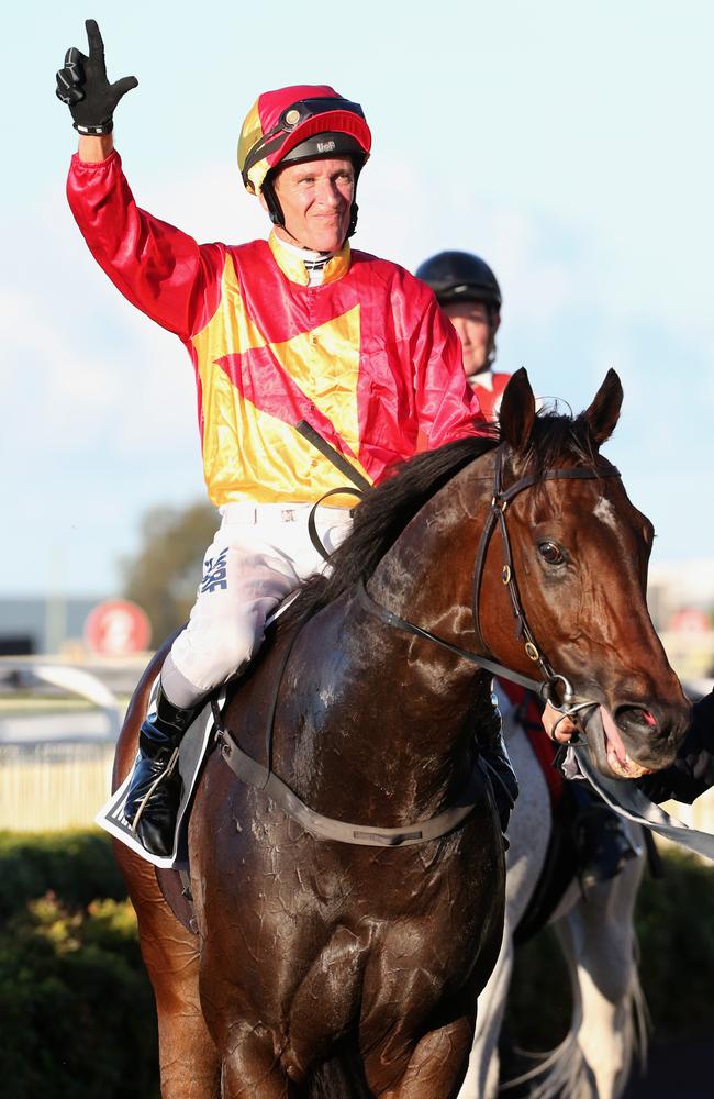 Jockey Glenn Colless acknowledges his victory aboard Victorian visitor Malaguerra. Picture: Jono Searle