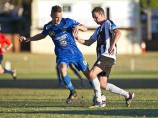 IN ACTION: USQ's Daniel Fuller (left) attempts to tackle Willowburn's Peter Millican in last year's Toowoomba Football League grand final. The team's will face each other in the opening round of this year's competition. Picture: Nev Madsen