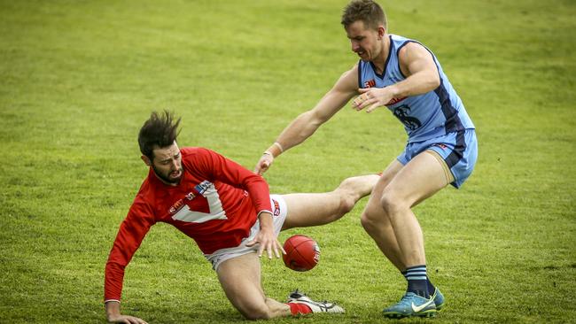 Tanner Smith beats Rory Taggert to the footy before the latter went off with an injury in the second term. Picture: AAP/MIKE BURTON