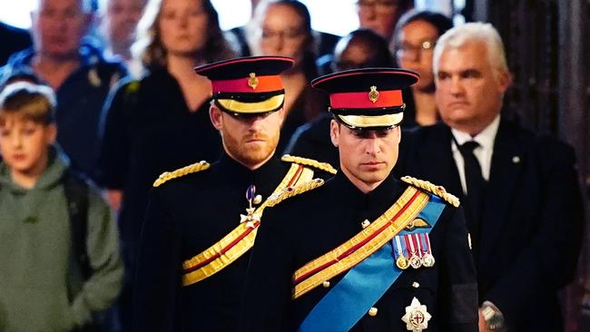 Prince William, Prince of Wales, Prince Harry, Duke of Sussex arrive to hold a vigil in honour of Queen Elizabeth II at Westminster Hall.