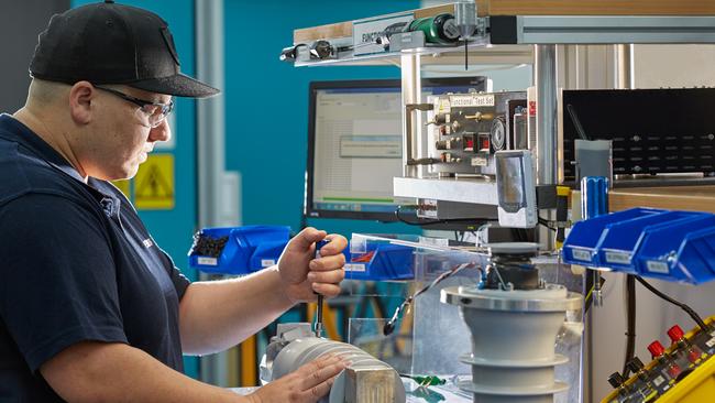 A worker at Siemens Fusesaver factory at Yatala