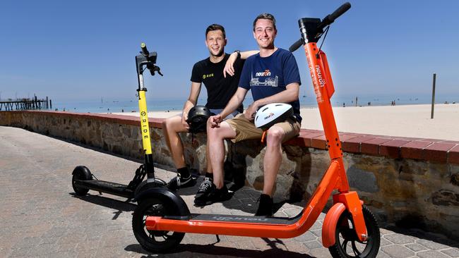 Toby Pym (Operations Manager RIDE) and Jayden Bryant (Neuron City Manager) at Glenelg Beach. Picture: Tricia Watkinson