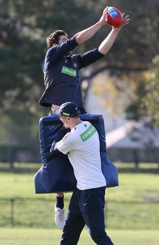 Levi Casboult flies for a mark over a tackle bag. Picture: Wayne Ludbey
