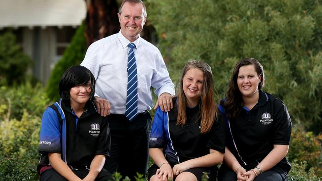 NEW BEGINNING: Playford International College principal Rob Knight with students Blake Clark, Teonnie Caddies and Katelyn Dunbar. The three students are among those at the school who have improved their attendance records this year. <b>Picture: </b>Calum Robertson