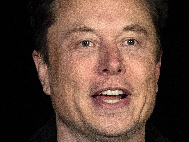 (FILES) In this file photo taken on February 10, 2022 Elon Musk gestures as he speaks during a press conference at SpaceX's Starbase facility near Boca Chica Village in South Texas. - Tesla Chief Executive Elon Musk often touts the arrival of completely autonomous vehicles as imminent, but exactly how close that future is for the electric automaker remains murky. Meanwhile, the company is launching new features in a US regulatory environment that has often taken a laissez-faire approach to emerging technologies, while using terms like Full Self Driving (FSD) that critics view as misleading. (Photo by JIM WATSON / AFP)