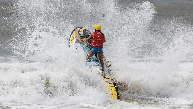 A lifeguard at Alex Heads during the Cyclone Alfred swell. Picture: Lachie Millard