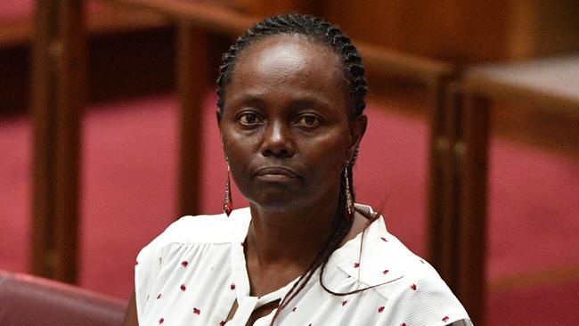 Liberal Senator Lucy Gichuhi in the Senate chamber at Parliament House in Canberra, Tuesday, September 11, 2018. Liberal senator Lucy Gichuhi appears to be backing away from threats to name and shame bullies within the party. The South Australian senator had threatened to use parliamentary privilege to publicly out colleagues accused of bullying and intimidation during last month's Liberal leadership crisis. (AAP Image/Mick Tsikas) NO ARCHIVING