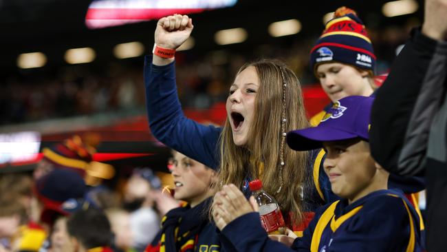 Crows fans celebrate after their stunning win on Thursday night. Picture: Phil Hillyard