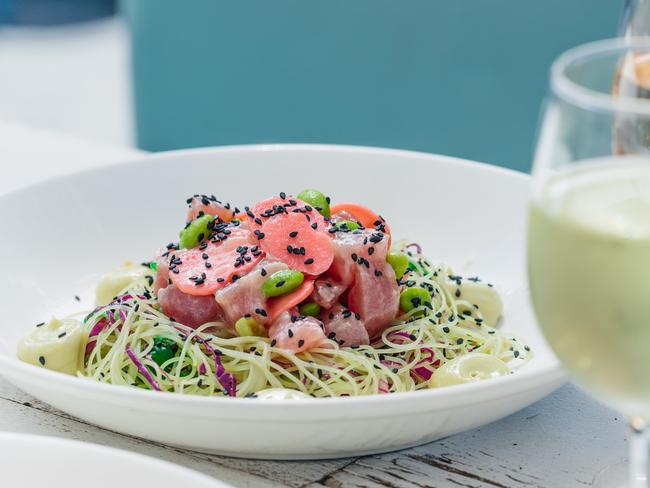 Coogee Bay Hotel Tuna Poké Bowls are made with raw tuna, rice noodles, red cabbage, edamame, seaweed, pickled zucchini, tobiko, sesame seeds and wasabi mayo.