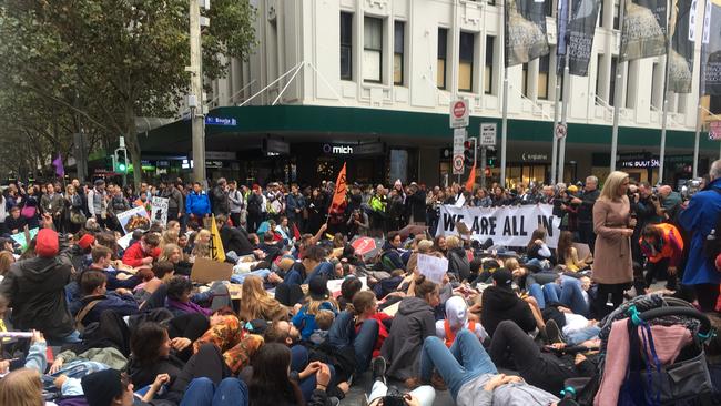 The "die-in" blocked the corner of Bourke Street and Swanson Street. Picture: Remy Varga