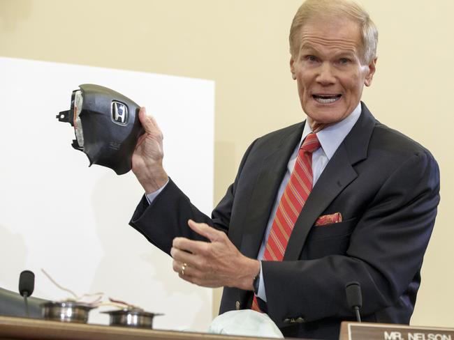 US Senate Commerce Committee member Senator Bill Nelson displays the parts and function of a defective airbag made by Takata of Japan that has been linked to multiple deaths and injuries in cars driven in America. Picture: AP / J. Scott Applewhite