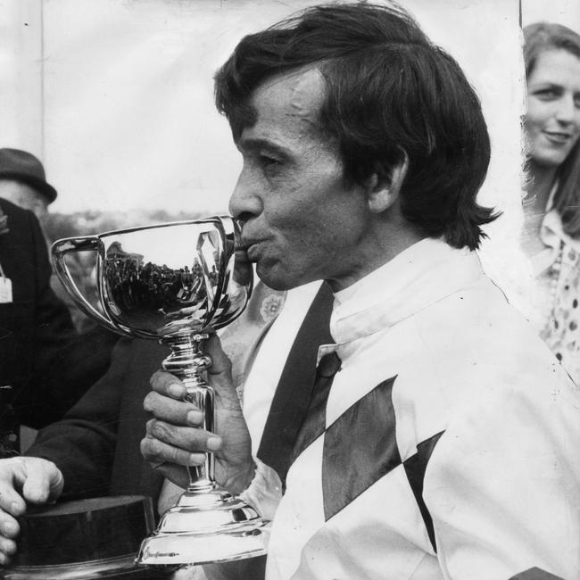 Jockey Frank Reys kisses the Melbourne Cup trophy he won for Pat Curtain, owner of racehorse Gala Supreme, in the 1973 Melbourne Cup. Mr Reys left St Augustine’s College at age 15 to pursue a career in jockeying.