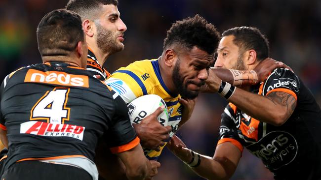 Benji Marshall gets a little taste of the Sivo fend. Photo: Cameron Spencer/Getty Images