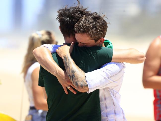 Friends of Gold Coast jockey Chris Caserta console each other. Picture: Adam Head